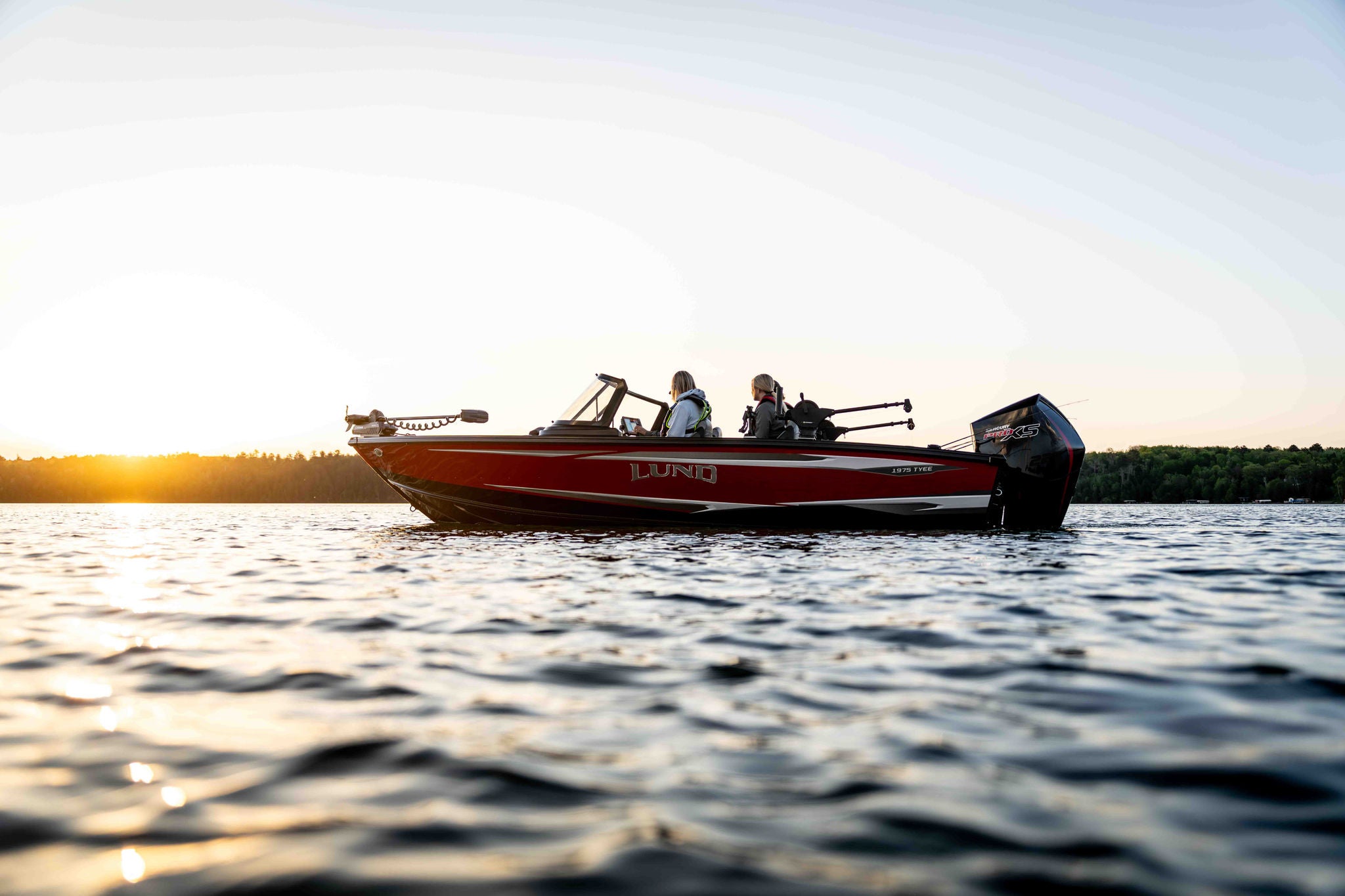 On the water at sunset on a Lund 1975 Tyee