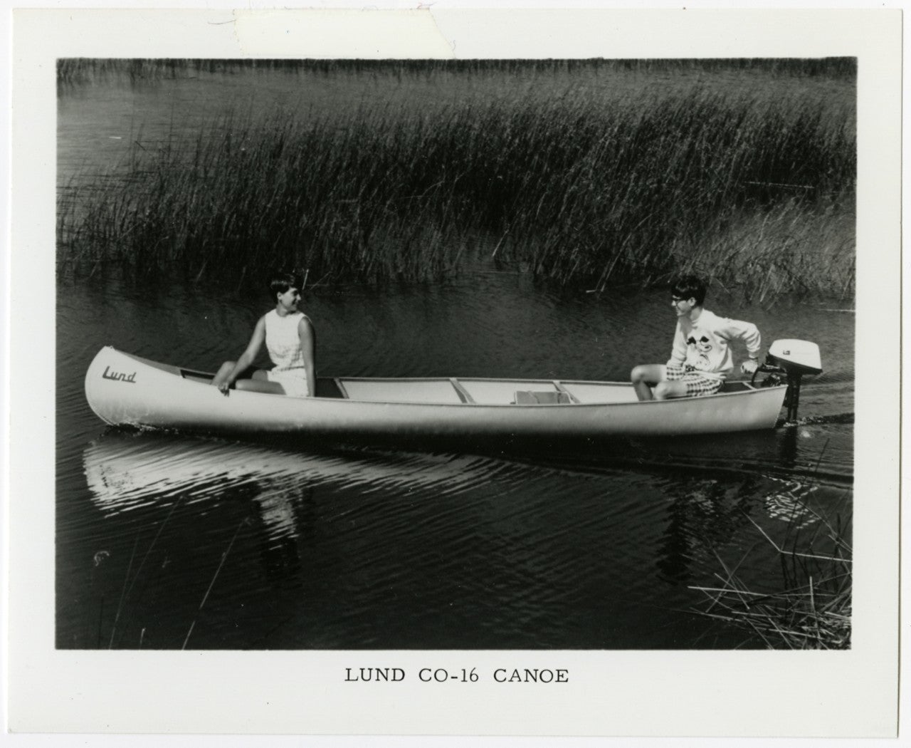 An old black and white newspaper clipping from the 60s of the Lund co-16 Canoe