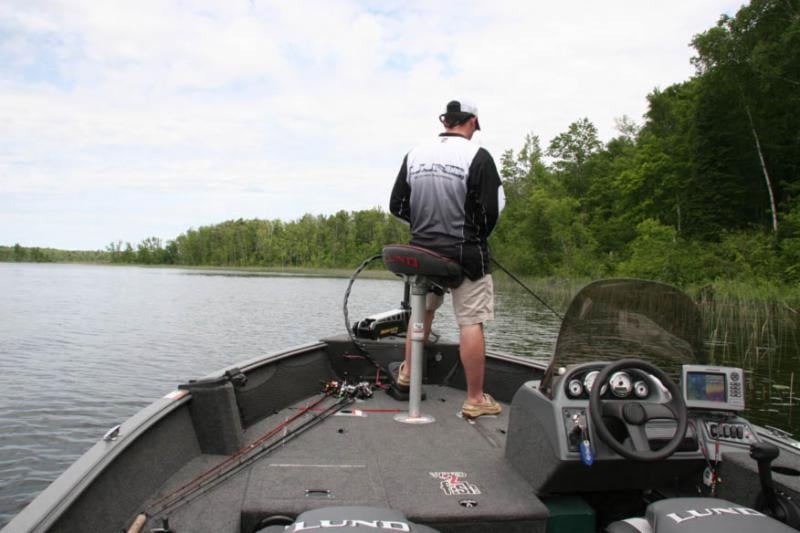 Fisherman on Lund Single Console Fishing Boat